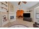 Living room with a cozy fireplace, Southwestern decor, and an open layout at 10718 E Fenimore Rd, Mesa, AZ 85207