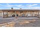 Outdoor patio with a stone bar, grill area, seating and a fireplace with desert views at 10718 E Fenimore Rd, Mesa, AZ 85207