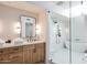 Modern bathroom with a glass-enclosed shower, tub, and oak vanity at 11199 E Prospect Point Dr, Scottsdale, AZ 85262