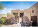 Front entrance featuring a brick wall and wooden entry gate at 11199 E Prospect Point Dr, Scottsdale, AZ 85262