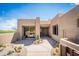 Desert home front entrance featuring large planters and a decorative wall at 11199 E Prospect Point Dr, Scottsdale, AZ 85262