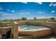 A relaxing hot tub offers stunning views of the surrounding desert landscape and sky at 11199 E Prospect Point Dr, Scottsdale, AZ 85262