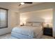 Well-lit bedroom with a large bed, recessed wall, and window with blinds at 11199 E Prospect Point Dr, Scottsdale, AZ 85262