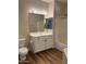 Bathroom with updated vanity, lighting, mirror and a shower-tub combo at 11500 E Cochise Dr # 2067, Scottsdale, AZ 85259