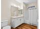 Well-lit bathroom featuring a vanity with double sinks and a shower-tub combo with a white shower curtain at 11500 E Cochise Dr # 2067, Scottsdale, AZ 85259
