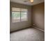 Comfortable bedroom featuring neutral tones, plush carpeting, and a bright window view at 11500 E Cochise Dr # 2067, Scottsdale, AZ 85259