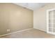 Neutral bedroom features carpeted floors, neutral walls, and a door with glass panes at 11500 E Cochise Dr # 2067, Scottsdale, AZ 85259