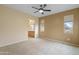 Bedroom with a ceiling fan and a view leading into the en-suite bathroom at 11500 E Cochise Dr # 2067, Scottsdale, AZ 85259
