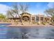 Beautiful community clubhouse featuring unique bronze statue and covered entryway at 11500 E Cochise Dr # 2067, Scottsdale, AZ 85259