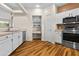 Bright kitchen with stainless steel appliances, white cabinets, and a built-in desk at 11500 E Cochise Dr # 2067, Scottsdale, AZ 85259