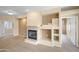 Inviting living room showcases a fireplace and decorative built-in shelves, creating a cozy ambiance at 11500 E Cochise Dr # 2067, Scottsdale, AZ 85259