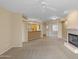 Cozy living room with a fireplace, open to the kitchen area for easy entertaining at 11500 E Cochise Dr # 2067, Scottsdale, AZ 85259
