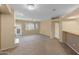 Spacious living room featuring neutral carpet, a ceiling fan, and ample natural light at 11500 E Cochise Dr # 2067, Scottsdale, AZ 85259