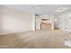 Spacious living room shows flow to kitchen and patio at 11500 E Cochise Dr # 2067, Scottsdale, AZ 85259