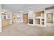 Large living room with fireplace and views to other rooms in the home at 11500 E Cochise Dr # 2067, Scottsdale, AZ 85259