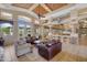Comfortable lounge area with multiple sofas and plenty of light from a large window at 11500 E Cochise Dr # 2067, Scottsdale, AZ 85259