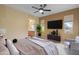 Tastefully decorated main bedroom with a ceiling fan, stylish furniture, and an en-suite bathroom at 11500 E Cochise Dr # 2067, Scottsdale, AZ 85259