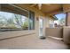 A covered patio with a ceiling fan, door, and large window provides a great outdoor retreat at 11500 E Cochise Dr # 2067, Scottsdale, AZ 85259