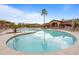 Large community pool with seating and palm trees, an ideal space for relaxing and socializing with neighbors at 11500 E Cochise Dr # 2067, Scottsdale, AZ 85259