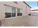 Spacious backyard featuring a large patio area with brick pavers, providing ample space for outdoor entertaining at 12343 W Essig Way, Peoria, AZ 85383