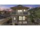 Two-story home with a covered front porch and balcony showcasing great natural light at 12343 W Essig Way, Peoria, AZ 85383