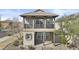 Charming home featuring a brick facade, covered porch, second story balcony, and desert landscaping at 12343 W Essig Way, Peoria, AZ 85383