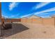 Large backyard area with rock landscaping, block wall, and an AC unit at 1250 E Eric Pl, Casa Grande, AZ 85122