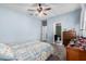Charming bedroom with a ceiling fan, carpeted floors and ensuite bathroom access at 1250 E Eric Pl, Casa Grande, AZ 85122