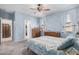 Cozy bedroom featuring carpeted floors, ceiling fan and bright natural lighting at 1250 E Eric Pl, Casa Grande, AZ 85122