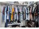 Walk-in closet with hanging clothes on rods and shelving, plus shoes on the floor at 1250 E Eric Pl, Casa Grande, AZ 85122