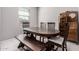 Inviting dining room with neutral walls, white tile floors, and a rustic wood dining table at 1250 E Eric Pl, Casa Grande, AZ 85122
