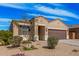 Charming single-story home featuring a two-car garage, neutral stucco, and low maintenance desert landscaping at 1250 E Eric Pl, Casa Grande, AZ 85122