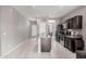 Bright kitchen showcasing an island, stainless steel appliances, and dark cabinets at 1250 E Eric Pl, Casa Grande, AZ 85122