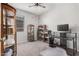 Bright office space features carpeted floors, a desk, display case, and a printer at 1250 E Eric Pl, Casa Grande, AZ 85122
