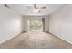 Bright and airy bedroom with balcony access, neutral carpet, and ample natural light for comfortable living at 131 N Higley Rd # 215, Mesa, AZ 85205