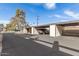 A covered parking area with multiple parking spaces, providing shelter for vehicles with a clean paved surface at 131 N Higley Rd # 215, Mesa, AZ 85205