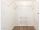 Walk-in closet with installed metal shelving at 131 N Higley Rd # 215, Mesa, AZ 85205