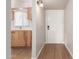 Inviting entryway with wood-look flooring, neutral walls, and a glimpse of the kitchen area at 131 N Higley Rd # 215, Mesa, AZ 85205