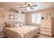 Inviting bedroom with shelving, shuttered windows and a ceiling fan at 1320 N Desoto St, Chandler, AZ 85224