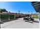 Backyard patio area with a seating arrangement and landscaped yard at 1611 E Palmcroft Dr, Tempe, AZ 85282