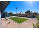 Expansive backyard featuring an artificial lawn and a paved patio area, perfect for outdoor relaxation at 1611 E Palmcroft Dr, Tempe, AZ 85282