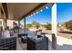 Covered patio with desert landscaping and plenty of space for outdoor living and entertaining at 16476 W Limestone Dr, Surprise, AZ 85374