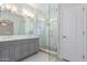 Bathroom featuring double vanity with granite countertop and glass shower with tiled flooring and walls at 17816 W Mariposa Dr, Surprise, AZ 85374