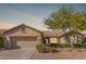 Charming single-story home with well-maintained landscaping and a two-car garage at 17816 W Mariposa Dr, Surprise, AZ 85374