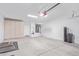 A spacious garage with storage cabinets, a garage door opener and extra room for storage at 17816 W Mariposa Dr, Surprise, AZ 85374