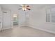 Spacious main bedroom with tile floor and access to the bathroom at 17816 W Mariposa Dr, Surprise, AZ 85374