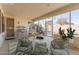 A staged patio with comfortable seating and a table with views of the outdoor area at 17816 W Mariposa Dr, Surprise, AZ 85374