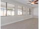 Bright and airy room with tile flooring and multiple windows at 17816 W Mariposa Dr, Surprise, AZ 85374