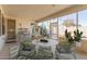 Bright sun room with floor-to-ceiling windows, ideal for relaxation and creative pursuits at 17816 W Mariposa Dr, Surprise, AZ 85374