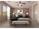 The bedroom features a comfortable bed, modern decor, and soft lighting at 18060 W Rimrock St, Surprise, AZ 85388